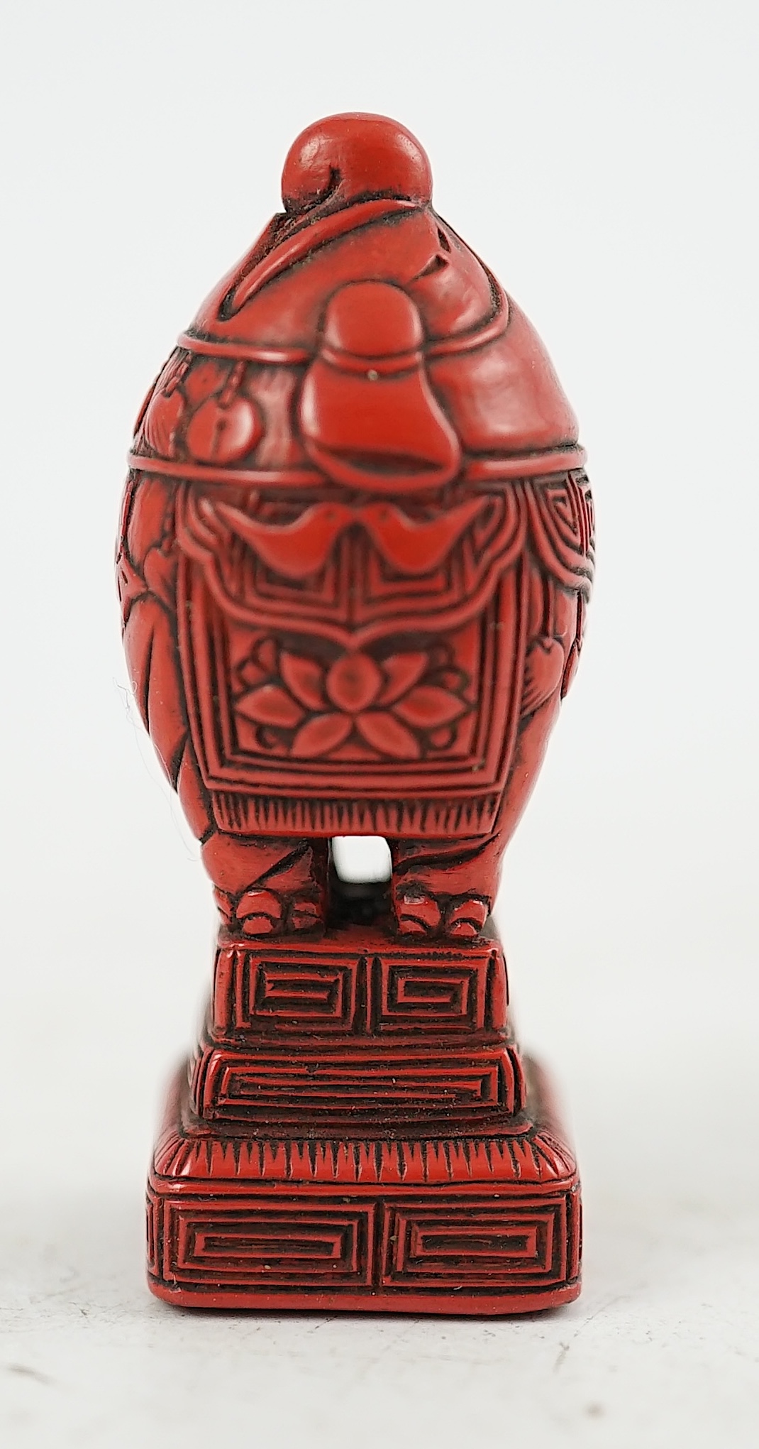 A small Japanese tsuishu (carved red lacquer) seal netsuke, 19th century